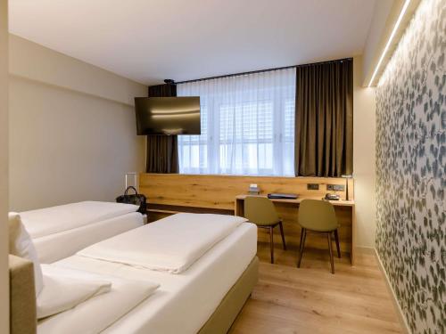 Katil atau katil-katil dalam bilik di Mercure Hotel München Altstadt