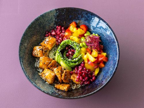 a bowl of food withinoa and vegetables on a table at Novotel Hamburg City Alster in Hamburg