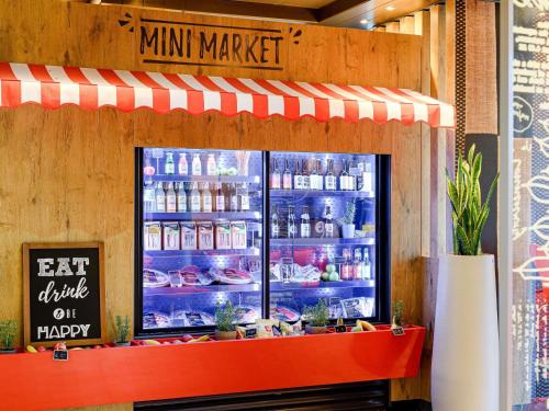 a mini market with a large display case with food at ibis Berlin City Potsdamer Platz in Berlin