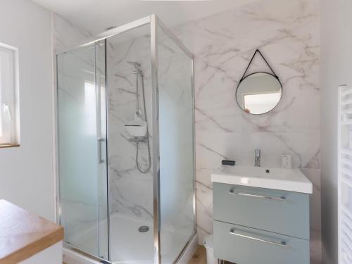 a bathroom with a shower and a sink and a mirror at Gîte de Charme : Calme, Nature, Proche du Mans, Terrasse, Jardin, Parking Privé - FR-1-410-397 in Montbizot