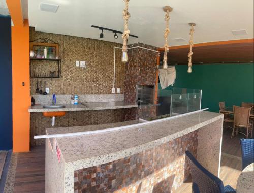 a bar in the lobby of a restaurant at Casa Azul in Camaçari