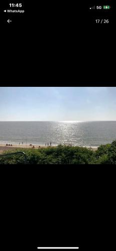 a picture of a beach with the ocean in the background at Tingdene caravan park north dene in Lowestoft