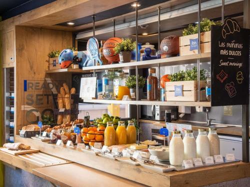 a store with a bunch of bottles of juice at Ibis Budget Madrid Calle Alcalá in Madrid