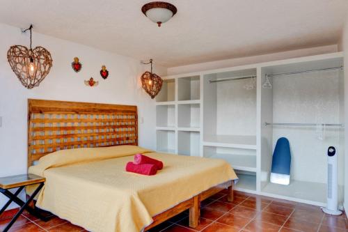 Ένα ή περισσότερα κρεβάτια σε δωμάτιο στο Casa Tres Lunas Centro