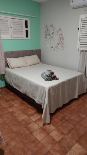 Cama ou camas em um quarto em Pousada Aconchego Manaíra
