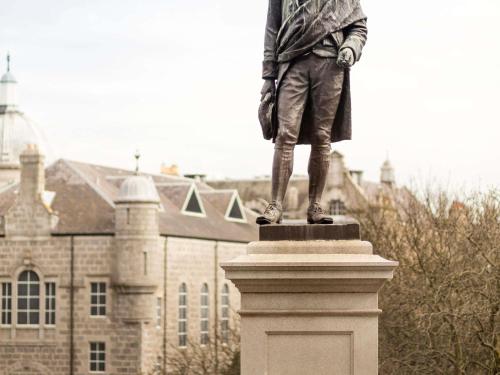 a statue of a man standing in front of a building at ibis Aberdeen Centre – Quayside in Aberdeen