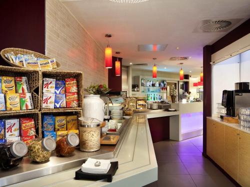 a kitchen with a counter with food on it at ibis Aberdeen Centre – Quayside in Aberdeen