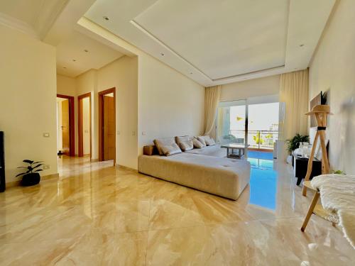 Katil atau katil-katil dalam bilik di Superbe appartement à Sidi Rahal