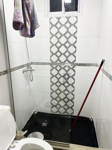 a bathroom with a shower with a toilet at La MERCED 