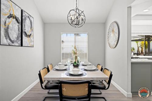 a dining room with a table and chairs at 4BR Chula Vista Getaway Splash, Play & Game! in Chula Vista