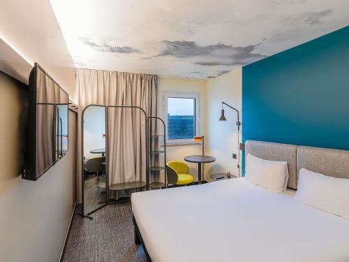 Postel nebo postele na pokoji v ubytování Hotel ibis Lisboa Alfragide