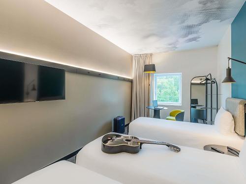 Postel nebo postele na pokoji v ubytování Hotel ibis Lisboa Alfragide