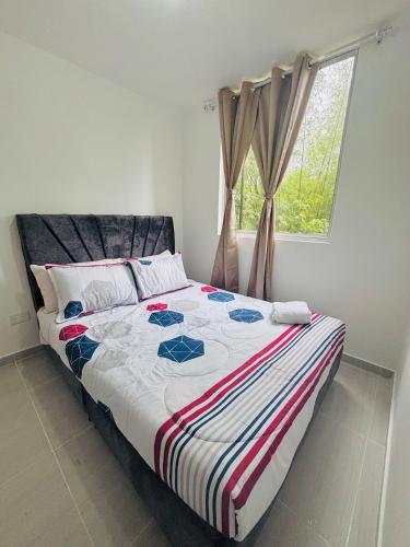 Postel nebo postele na pokoji v ubytování Apartamento Lotus 203 - Cantón militar Jaime Rooke