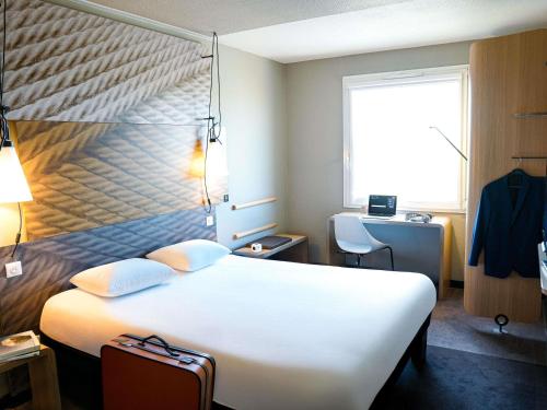 เตียงในห้องที่ ibis Caen Porte De Bretagne