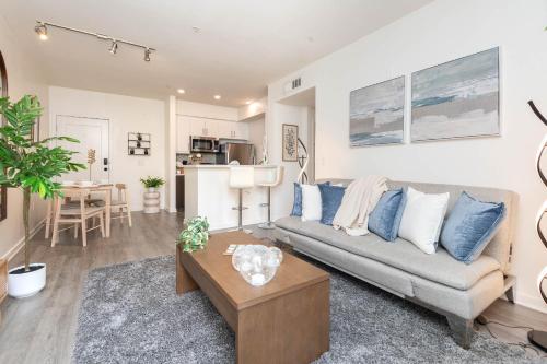 a living room with a couch and a table at Hollywood Stars 2 Bedroom Apartment in Los Angeles