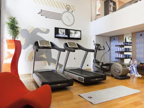 a gym with two exercise bikes in a room at Novotel Monte-Carlo in Monte Carlo