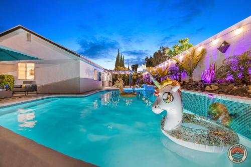 a pool at a resort with a unicorn in the water at 4BR Chula Vista Getaway Splash, Play & Game! in Chula Vista