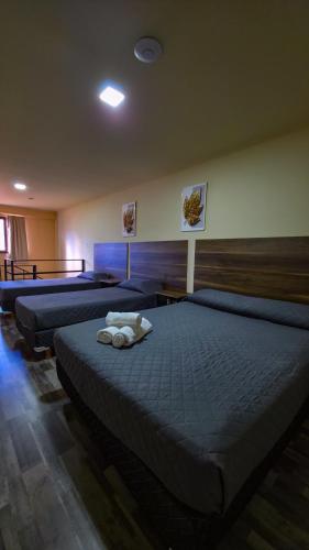 Katil atau katil-katil dalam bilik di Apartamentos Matices Centro