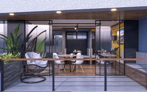 a restaurant with white chairs and tables on a balcony at Edificio Living 42 - Apto 105 in Estación El Salto