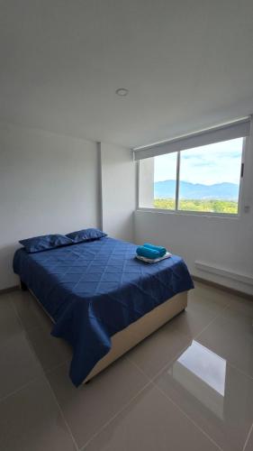 Uma cama ou camas num quarto em Apartment with pool near Parque de Santafé
