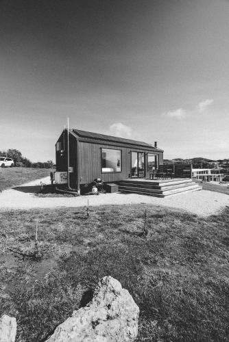 a black and white photo of a house at Swell At Cape Bridgewater in Cape Bridgewater