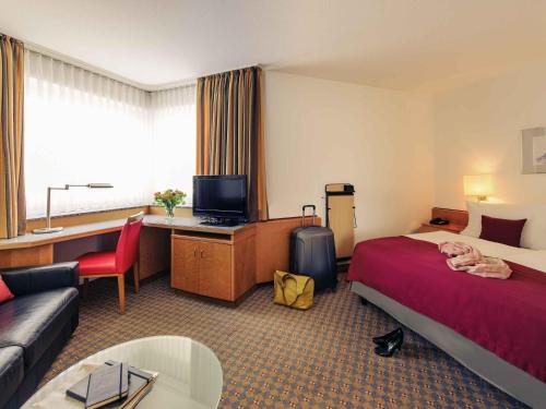 Ένα ή περισσότερα κρεβάτια σε δωμάτιο στο Mercure Hotel Köln City Friesenstraße