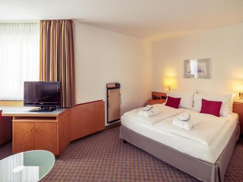 Ένα ή περισσότερα κρεβάτια σε δωμάτιο στο Mercure Hotel Köln City Friesenstraße