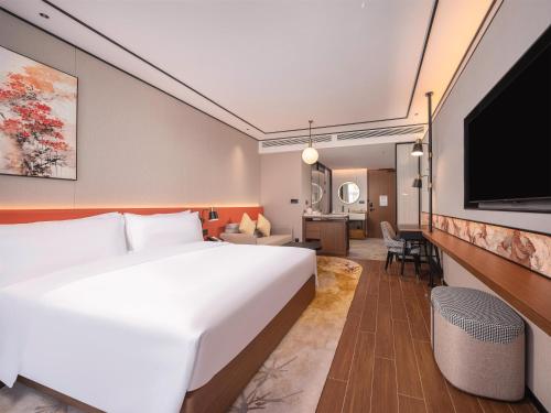 Μια τηλεόραση ή/και κέντρο ψυχαγωγίας στο Hilton Garden Inn Huangshan Huizhou