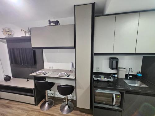Majoituspaikan Studio Bem Localizado - Moema keittiö tai keittotila