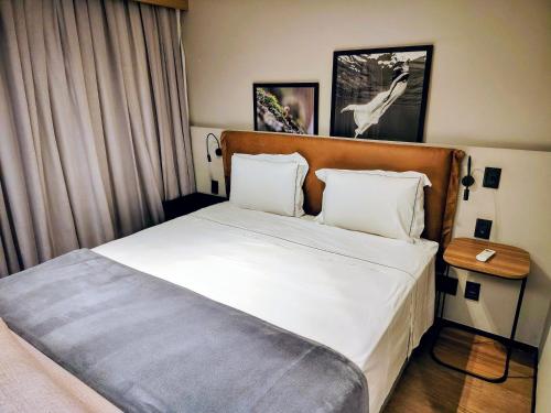 Ένα ή περισσότερα κρεβάτια σε δωμάτιο στο The Capital Flat Luxo Itaim Bibi