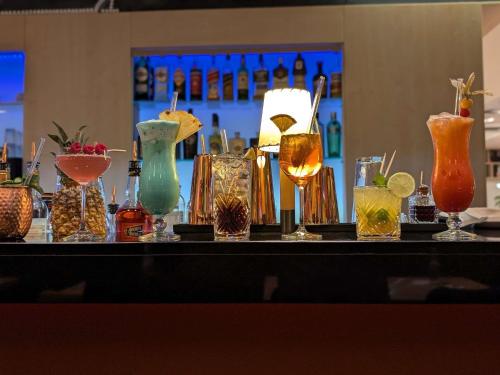 a table with many different types of glasses on it at Mercure Hotel Hamburg Mitte in Hamburg
