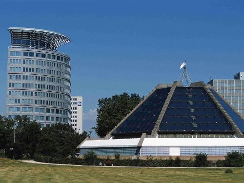 a large building with a bird on top of it at Mercure Hotel Mannheim am Rathaus in Mannheim