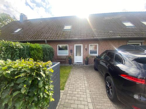 a car parked in front of a house at Lykkehus in Humptrup