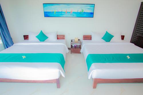 Postel nebo postele na pokoji v ubytování Adora Bay Ke Ga Beach Resort