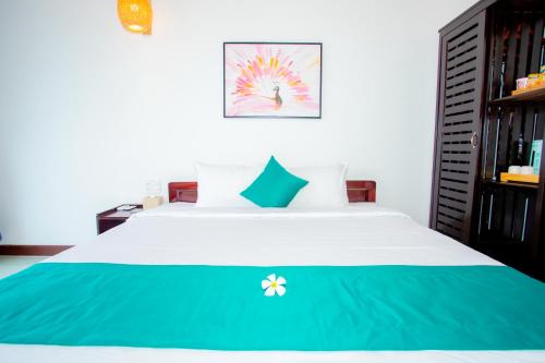 Postel nebo postele na pokoji v ubytování Adora Bay Ke Ga Beach Resort