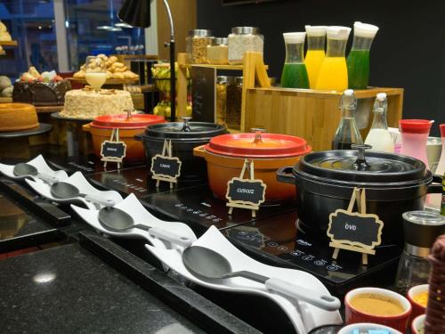 a group of spoons on a counter in a kitchen at ibis Aracaju in Aracaju