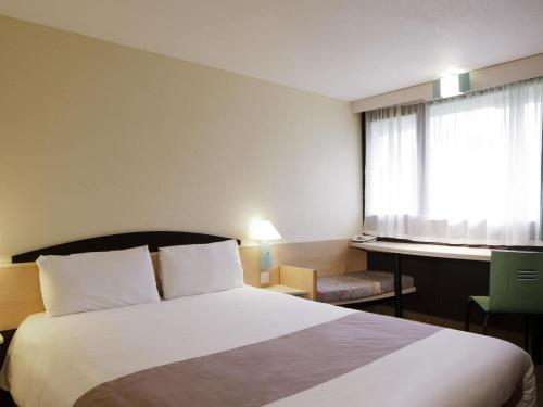 Voodi või voodid majutusasutuse Ibis Madrid Alcorcon Tresaguas toas