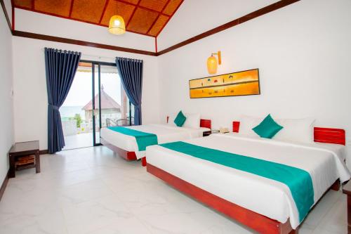 Postel nebo postele na pokoji v ubytování Adora Bay Ke Ga Beach Resort