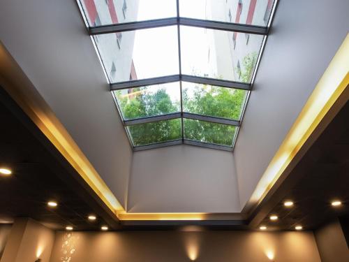 a large window in the ceiling of a building at Ibis Praha Old Town in Prague