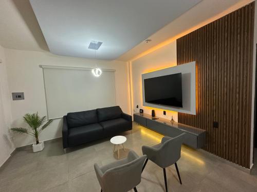 TV a/nebo společenská místnost v ubytování Casa Lujosa, Catemaco, Ubicación Céntrica