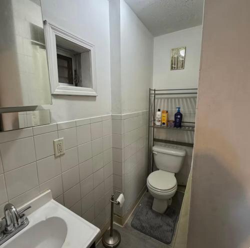 a small bathroom with a toilet and a sink at Location! Location! 2bd 1bth spacious apartment! in Chicago