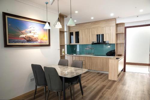 a kitchen and dining room with a table and chairs at Thảo Aparment Hạ Long in Ha Long