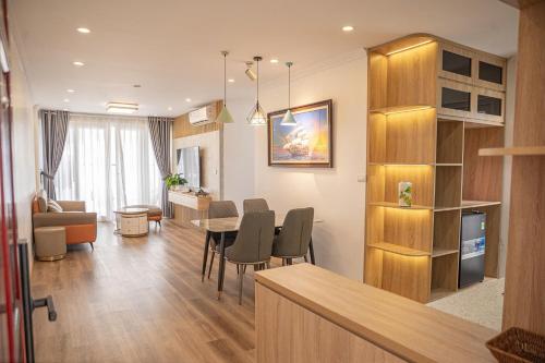 a kitchen and living room with a table and chairs at Thảo Aparment Hạ Long in Ha Long