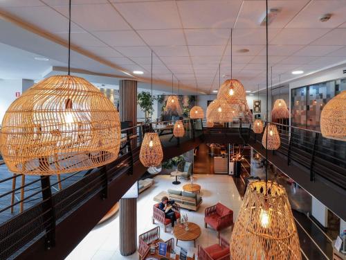 an overhead view of a lobby with chandeliers at Novotel Luxembourg Centre in Luxembourg