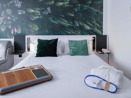 a bed with a tray on top of it at Novotel Luxembourg Centre in Luxembourg