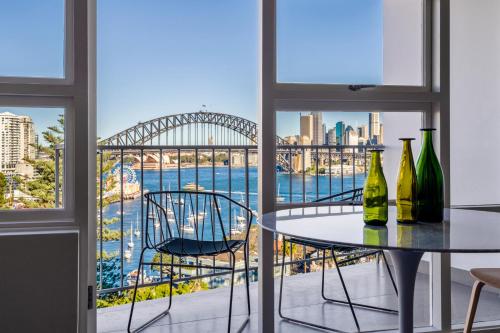 a view of the sydney harbour bridge from a room at Breathtaking Sydney Harbour Views from Stylish Harbourside Studio in Sydney