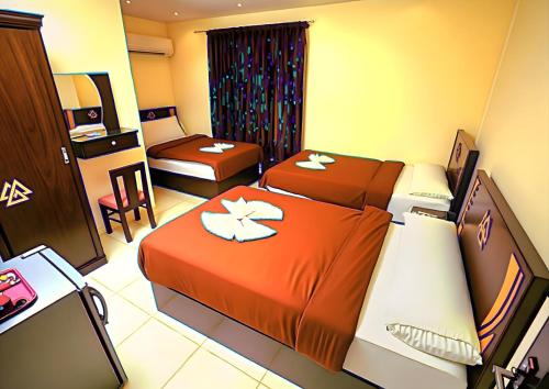 a hotel room with two beds in a room at Pyramids Sphinx VIEW Hotel in Cairo