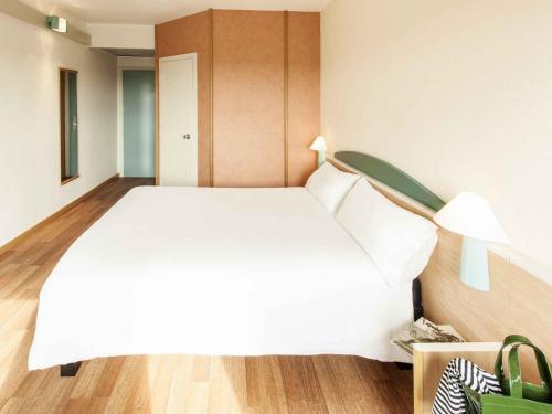 Кровать или кровати в номере Ibis Roma Fiera