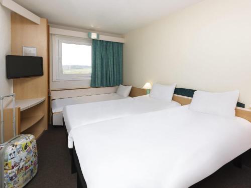 Cama o camas de una habitación en ibis Luxembourg Sud