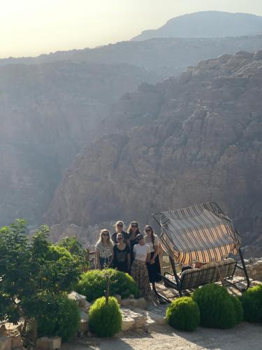 a group of women standing in front of a mountain at Dana luxury huts in Dana